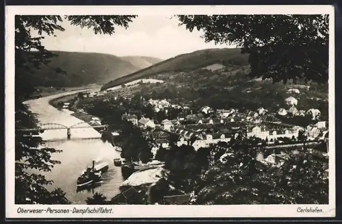AK Carlshafen, Oberweser-Personen-Dampfschifffahrt, Ortsansicht mit Brücke, Raddampfer