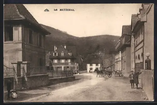 AK Metzeral, Rue principale avec charrette et maisons traditionnelles