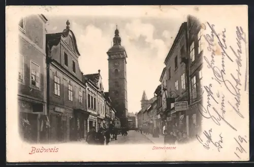 AK Budweis-Ceske Budejovice, Sternekgasse mit Geschäften und Passanten, Kirchturm