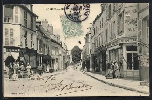 AK Nogent-sur-Seine, Rue commercante animée avec passants et boutiques