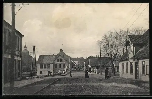AK Walsrode, Strasse Vorbrück nach Walsrode mit Automobil- und Fahrradhandlung