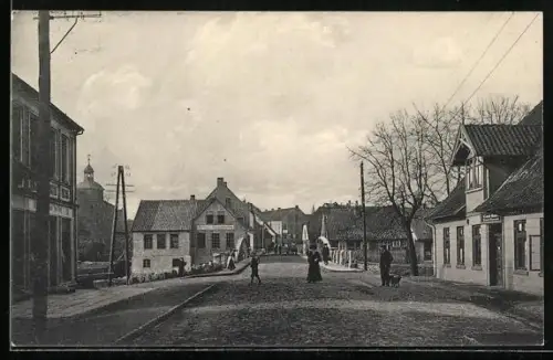 AK Walsrode, Strasse Vorbrück nach Walsrode mit Automobil- und Fahrradhandlung
