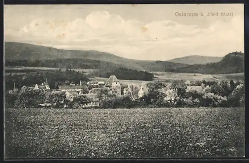 AK Osterode b. Ilfeld, Ortsansicht mit Feldern und umliegenden Bergen