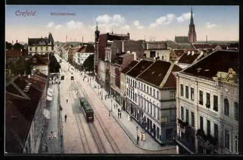 AK Crefeld, Blick auf die Rheinstrasse mit Strassenbahn und Kirche