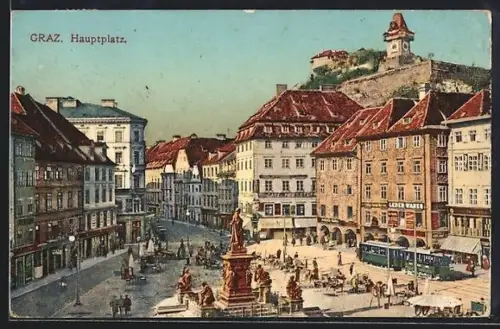 AK Graz, Blick auf den Hauptplatz mit Denkmal und Uhrturm im Hintergrund, Strassenbahn