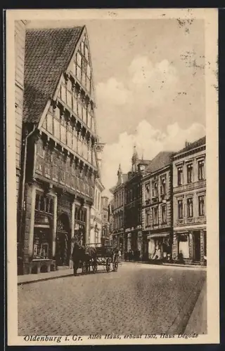 AK Oldenburg i. Gr., Altes Haus erbaut 1502, Haus Degode, Strassenpartie