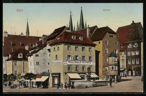 AK Eger, Stöckl, Ortspartie mit Brunnen u. Geschäft Willibald Kofend, Turmspitzen