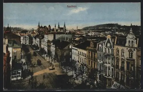 AK Aachen, Stadtansicht mit befahrener Strasse, Strassenbahnen