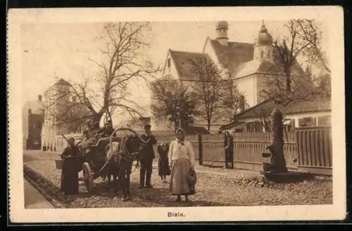 AK Biala, Strassenpartie an der Kirche, Pferdegespann
