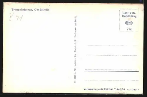 AK Treuenbrietzen, Grossstrasse mit Geschäft von Erika Müller und Kirche