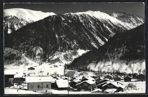 AK Reckingen /Wallis, Teilansicht mit Kirche im Schnee