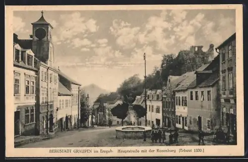 AK Graupen im Erzgeb., Hauptstrasse mit der Rosenburg