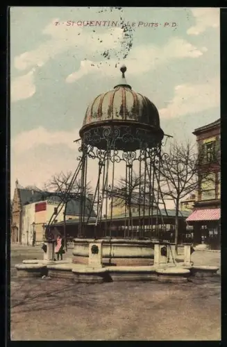 AK St-Quentin, Le Puits avec sa structure en fer forgé sur la place principale