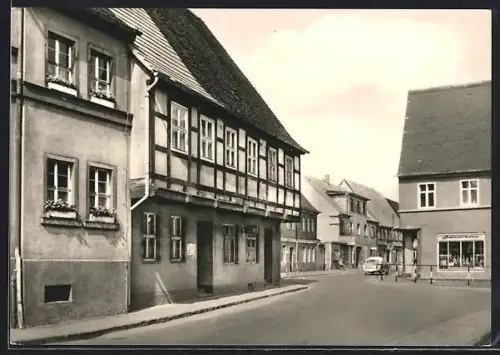 AK Bad Düben /Mulde, Strassenpartie mit Alter Post und Geschäft für Lederwaren