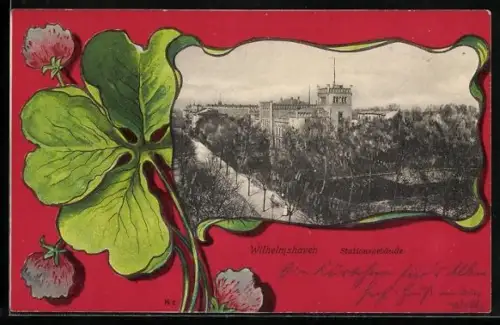 AK Wilhelmshaven, Blick auf das Stationsgebäude im Passepartout, vierblättriges Kleeblatt