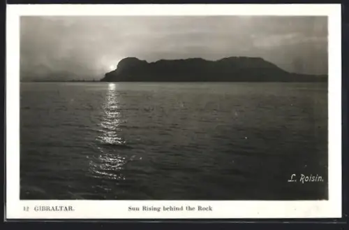 AK Gibraltar, Sun rising behind the rock