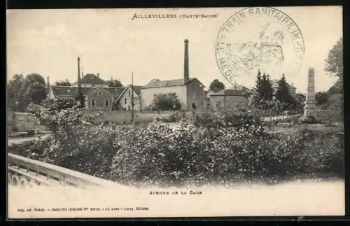 AK Aillevillers /Haute-Saône, Avenue de la Gare avec bâtiments industriels et obélisque