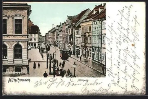 AK Mühlhausen / Thür., Steinweg mit Strassenbahn und Passanten