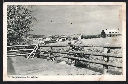AK Schledehausen / Bissendorf, Winterlandschaft mit verschneitem Zaun und Ortsansicht