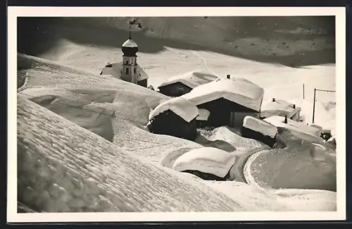 Foto-AK Stuben am Arlberg, Blick auf die tief verschneite Ortschaft