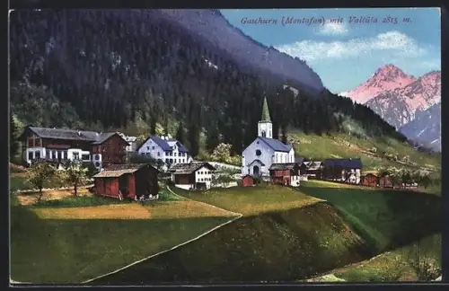 AK Gaschurn /Montafon, Teilansicht des Ortes mit anliegendem Wald