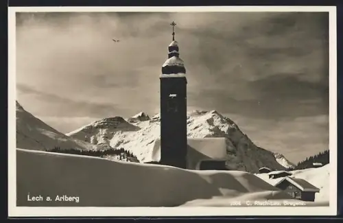 AK Lech a. Arlberg, Ansicht der verschneiten Kirche im Winter