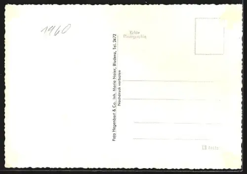 AK Bürserberg, Teilansicht des Ortes im Winter mit verschneiten Berghängen