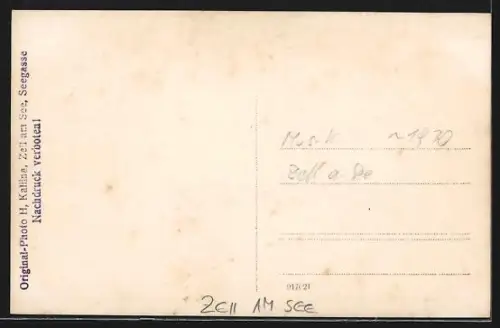 AK Zell am See, Trachten-Blasorchester beim Strassenumzug, um 1930