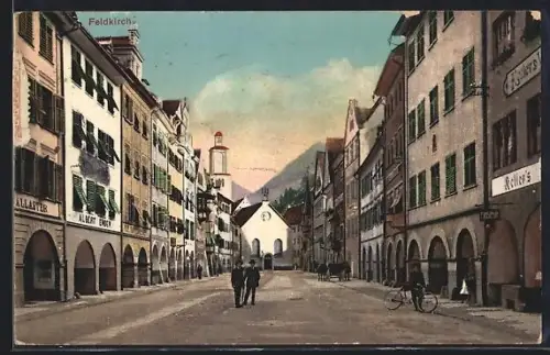 AK Feldkirch, Strassenpartie mit Kirche und Geschäft von Albert Ender