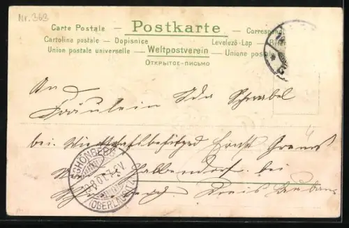 Präge-AK Kind liegt umringt von Vergissmeinnicht auf einer Wiese