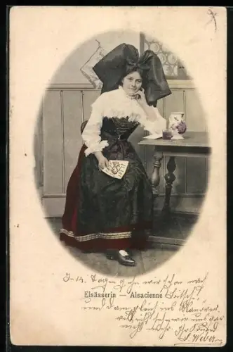 AK Elsässerin in Tracht am Tisch