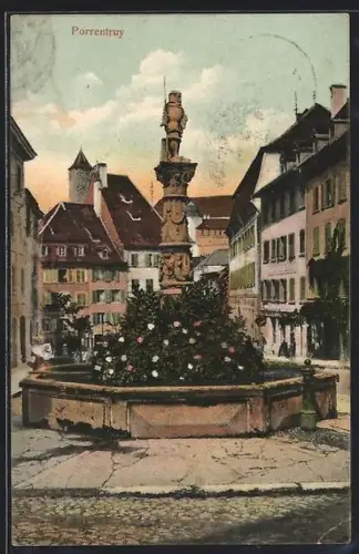 AK Porrentruy, Strassenpartie mit Brunnen