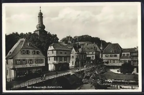 AK Bad Kreuznach, Nahebrücke und Geschäft von Chr. Wöhrle und Optiker Gravius