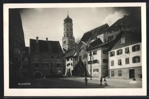 AK Bludenz, Strassenpartie mit Geschäften und Kirche