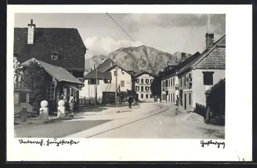 AK Unterach am Attersee, Strassenpartie mit Gasthof zum Anker