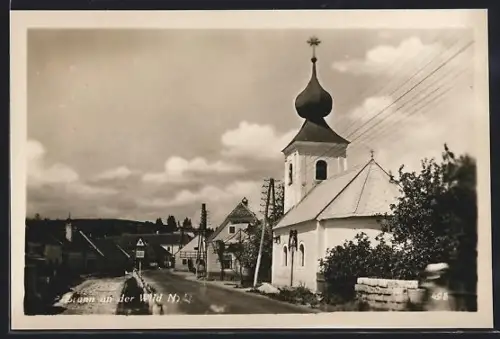 AK Brunn an der Wild, Strassenpartie mit Kirche