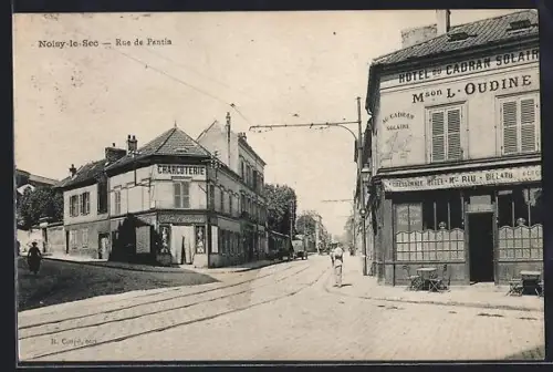 AK Noisy-le-Sec, Rue de Paris avec hôtel et charcuterie