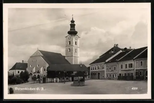 AK Waizenkirchen /O. D., Strassenpartie mit Geschäften und Kirche