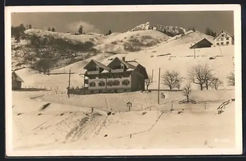 AK Brand /Vorarlberg, Winteransicht mit Alpenpension Nessler am schneebedeckten Hang