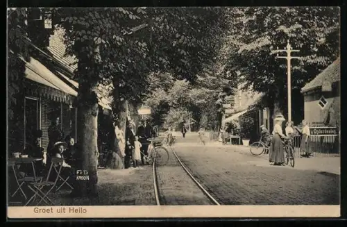 AK Heilo, Strassenpartie mit Strassenbahnschienen und Gaststätte