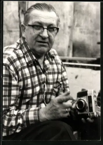 Fotografie Fotograf mit seiner Fotokamera