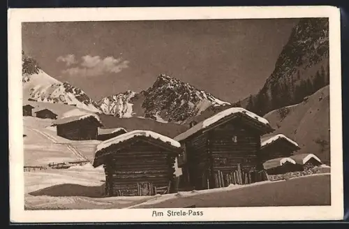 AK Strela-Pass, Holzhäuser im Schnee