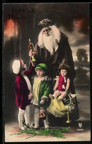 AK Zwei Kinder mit dem Weihnachtsmann, der ihnen Geschenke bringt