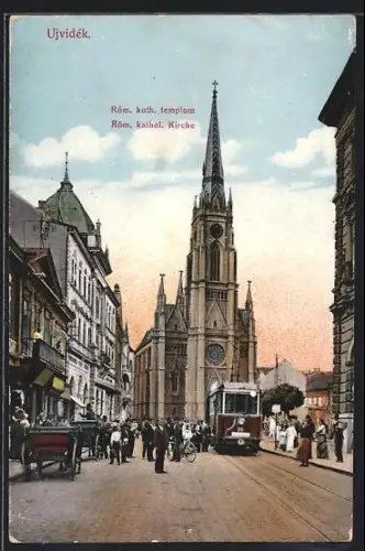 AK Ujvidék, Strassenbahn an der Róm. kathol. Kirche