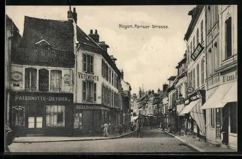 AK Noyon, Rue de Paris avec boutiques et passants