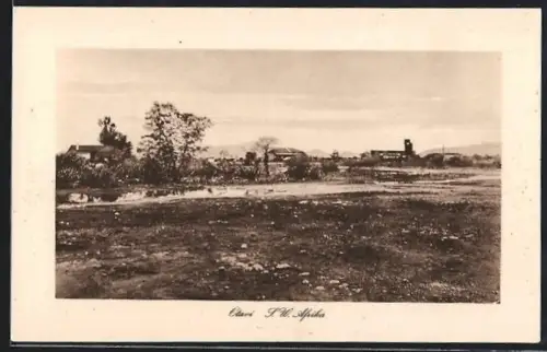 AK Otavi /S. W. Afrika, Teilansicht des Ortes mit Wasserlache im Vordergrund
