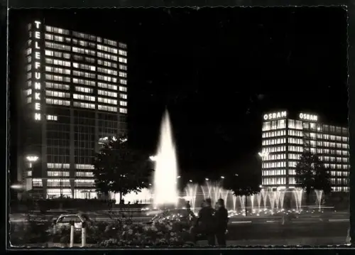 AK Berlin, Ernst Reuter-Platz mit Osram-Geschäftshaus bei Nacht