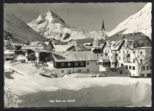 AK Galtür, Winteransicht mit Kirche und Bergpanorama