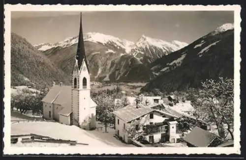 AK Finkenberg /Zillertal, Kirche im verschneiten Ort, Gebirgspanorama