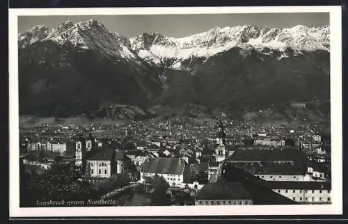 AK Innsbruck, Teilansicht mit Kirche gegen Nordkette